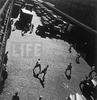 Andreas Feininger -&nbsp;Andreas Feininger Playing Ball Outside Hudson River Pier Sheds, New York