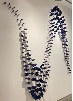 Work: Daniele Sigalot 200 Paper Planes Simultaneously Hitting the Wall